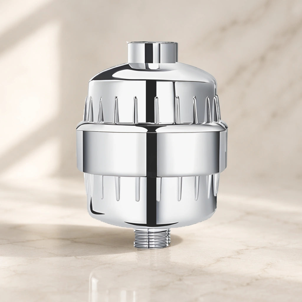 Assembled ZymeFresh chrome shower filter on a warm-white surface