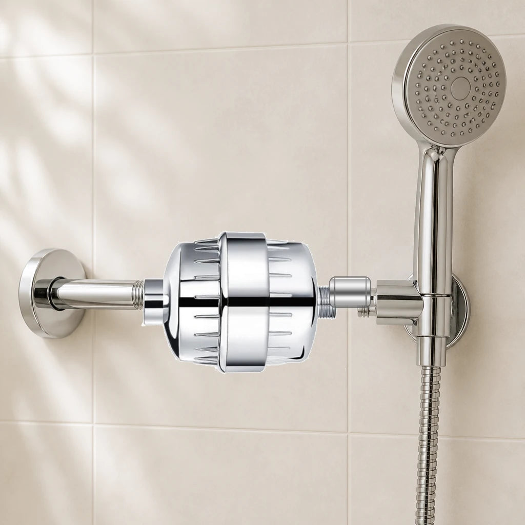 Chrome shower filter installed between a shower hose and a handheld showerhead